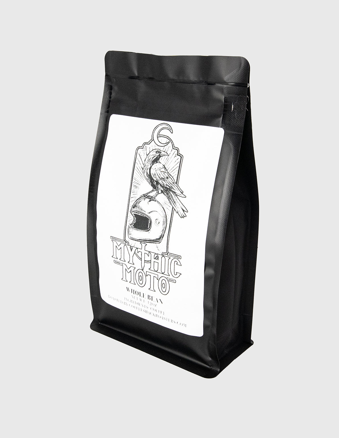 Black coffee bag with 'Mythic Moto' label on a light gray background Whole Bean