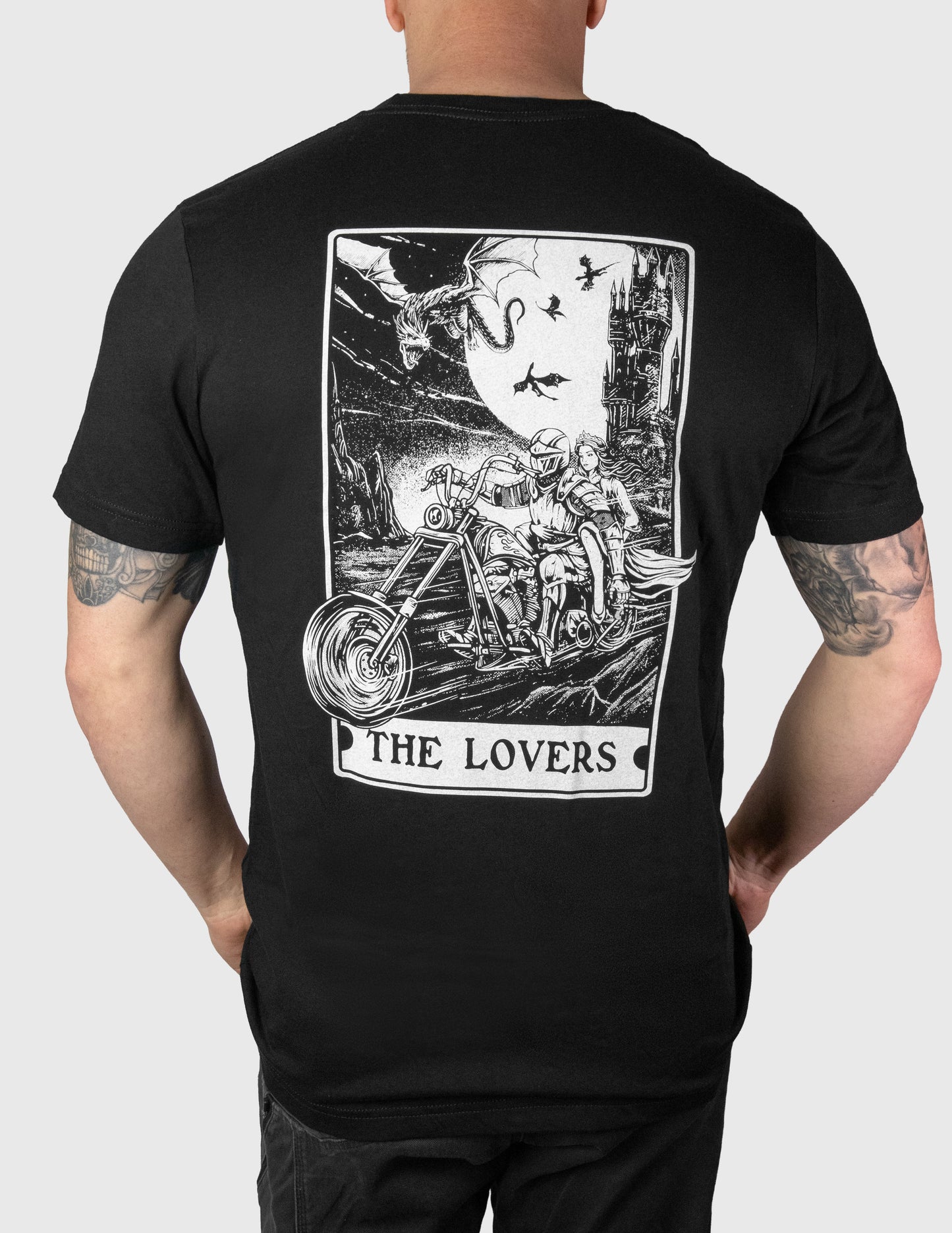 Black t-shirt with 'The Lovers' tarot card design on the back, worn by a person.