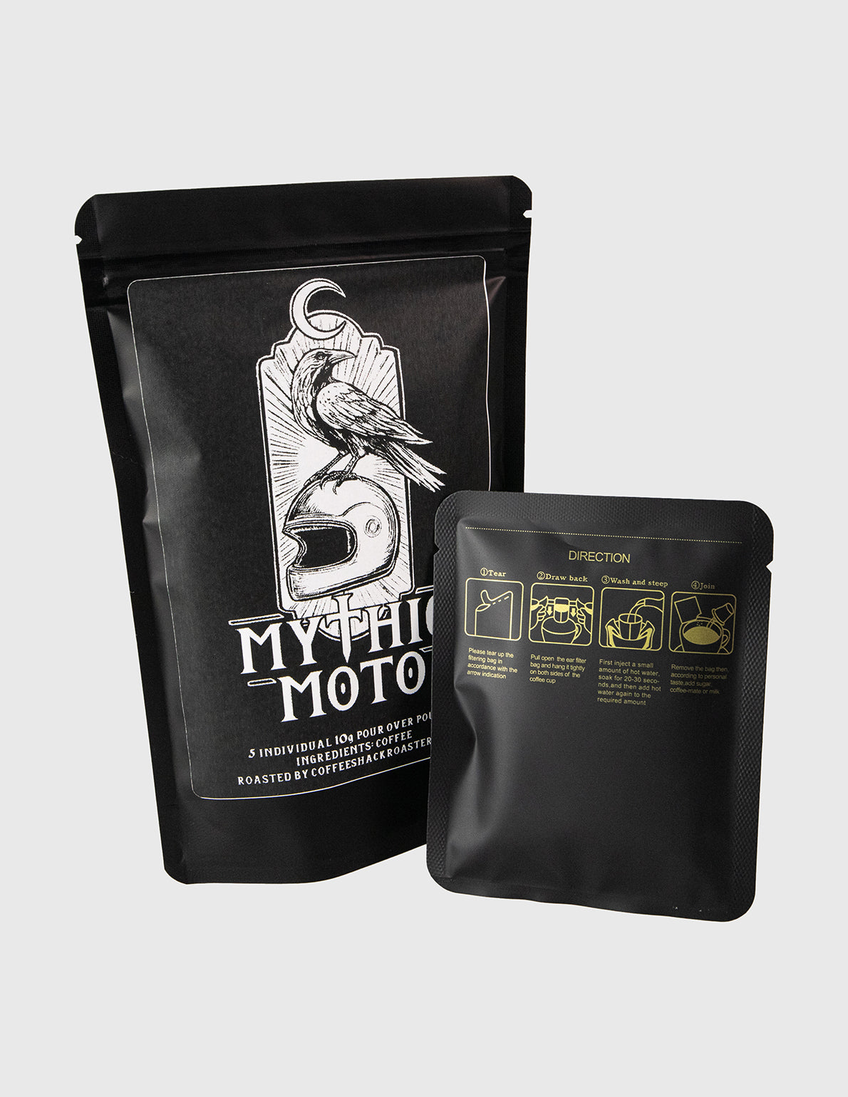 Two black coffee bags with branding on a light gray background. travel pour over coffee
