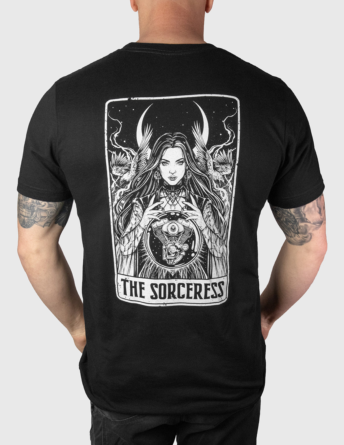 Black t-shirt with 'The Sorceress' design on the back, worn by a person.